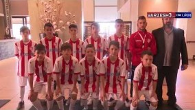 حضور کریم انصاری فرد و تیم المپیاکوس در یک مدرسه