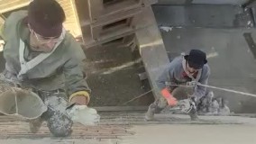 سیمانکاری دیوار کناری ساختمان با طناب